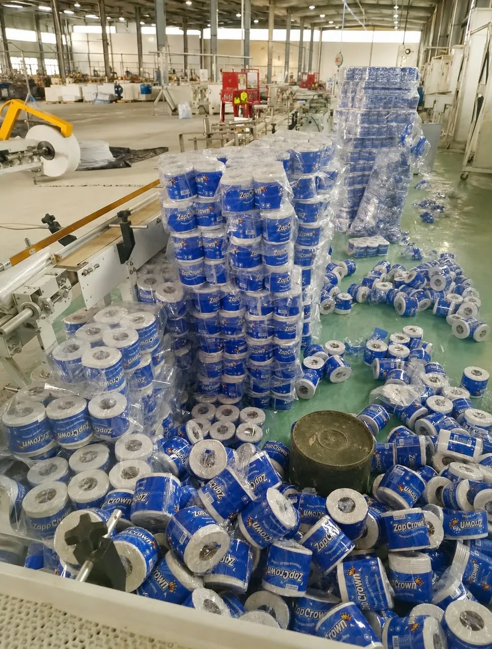 Stacks of ZapCrown toilet tissue rolls ready for distribution